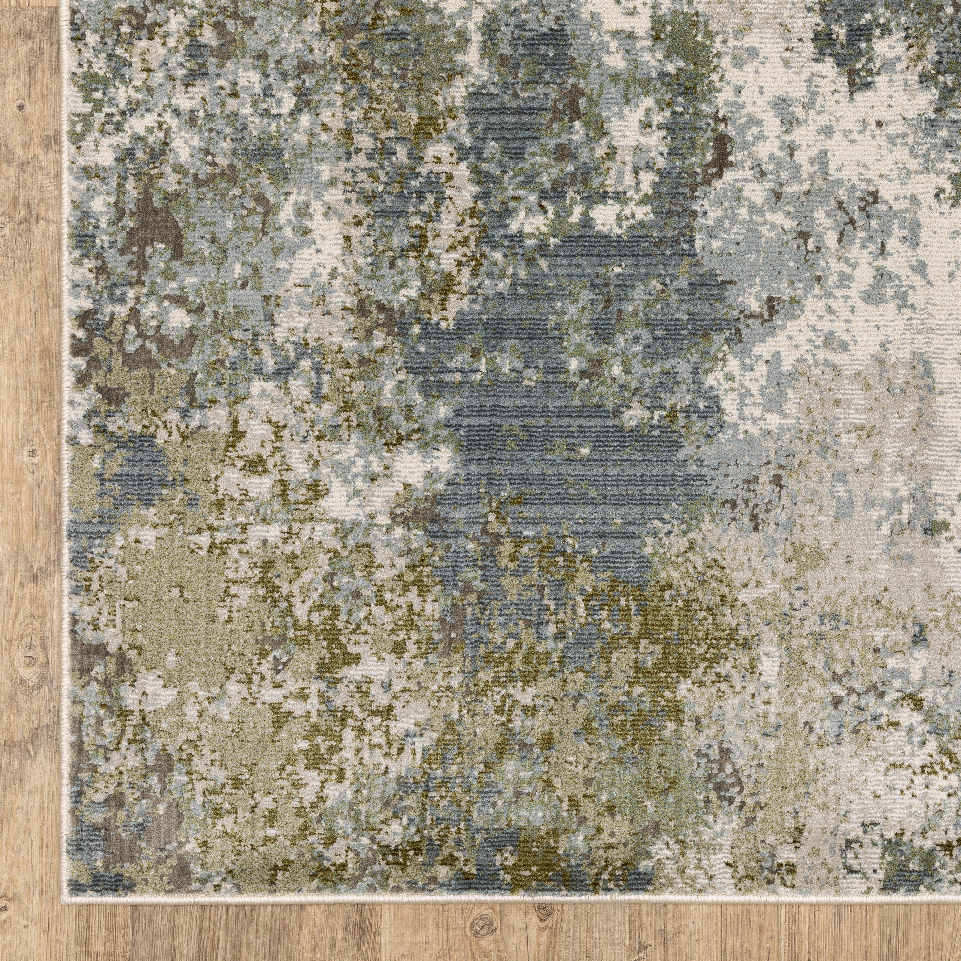 Modern distressed area rug with grey, cream, and olive abstract texture pattern