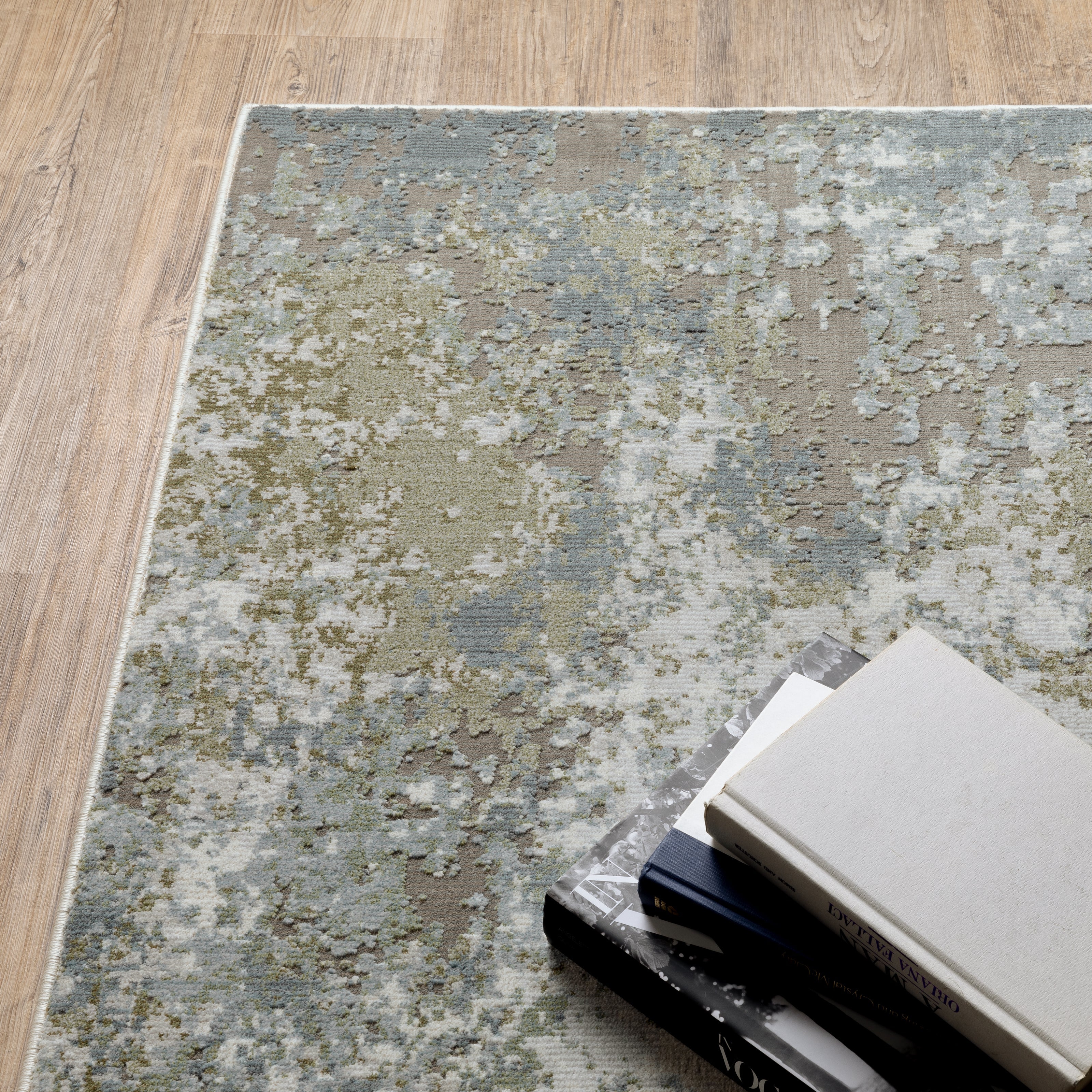 Modern distressed area rug with grey, cream, and olive abstract texture pattern