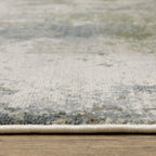 Modern distressed area rug with grey, cream, and olive abstract texture pattern
