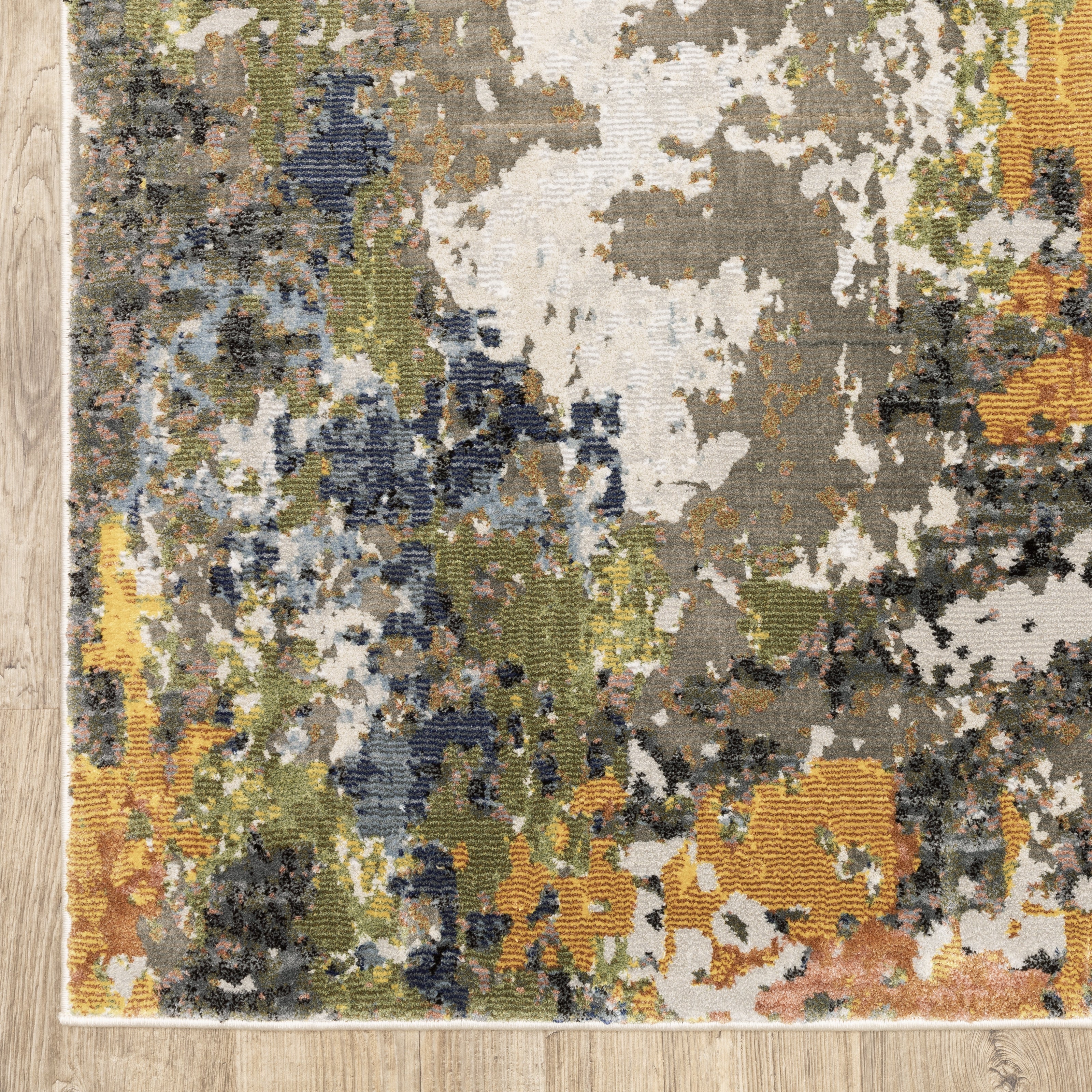Modern abstract area rug with distressed gold, gray, and blue speckled pattern