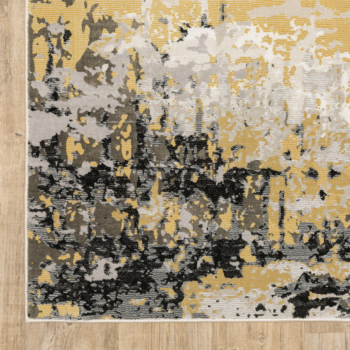 Abstract distressed rug with gold, black, and cream tones, worn texture design