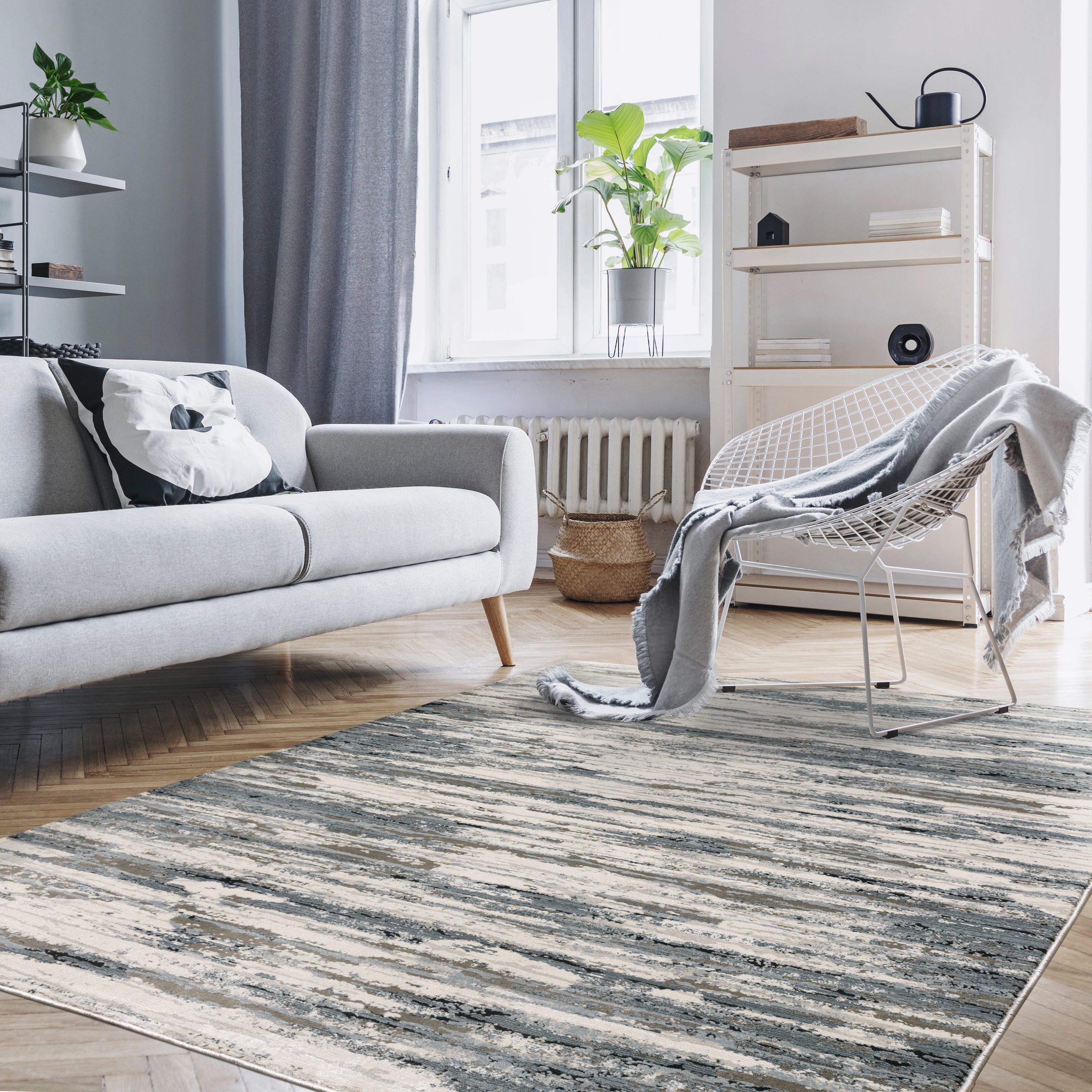 Modern grey and cream striped rug with distressed texture and abstract horizontal pattern
