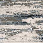 Modern grey and cream striped rug with distressed texture and abstract horizontal pattern