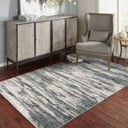 Modern grey and cream striped rug with distressed texture and abstract horizontal pattern