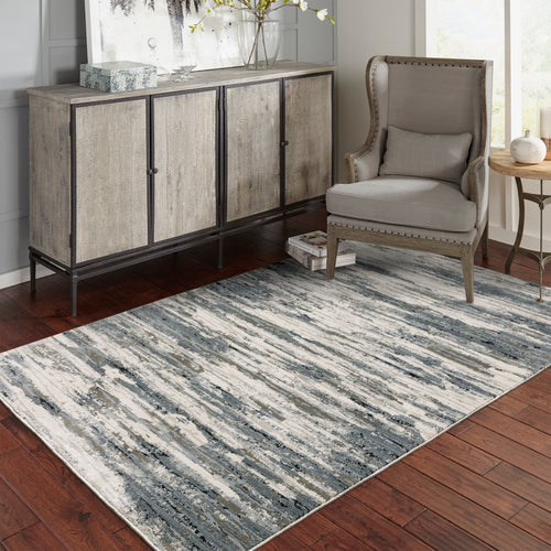 Modern grey and cream striped rug with distressed texture and abstract horizontal pattern