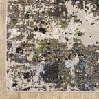 Abstract distressed area rug with grey, black, white and yellow splatter pattern