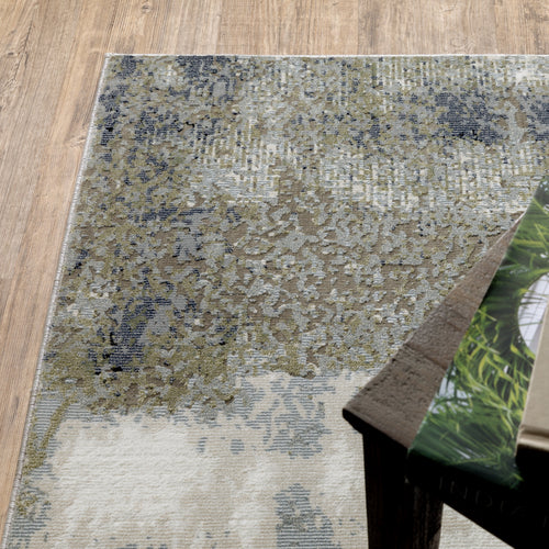 Abstract grey and cream distressed rug with textured weathered design