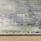 Abstract grey and cream distressed rug with textured weathered design