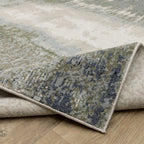 Abstract grey and cream distressed rug with textured weathered design