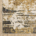Distressed gold and cream abstract rug with vintage texture and weathered pattern design
