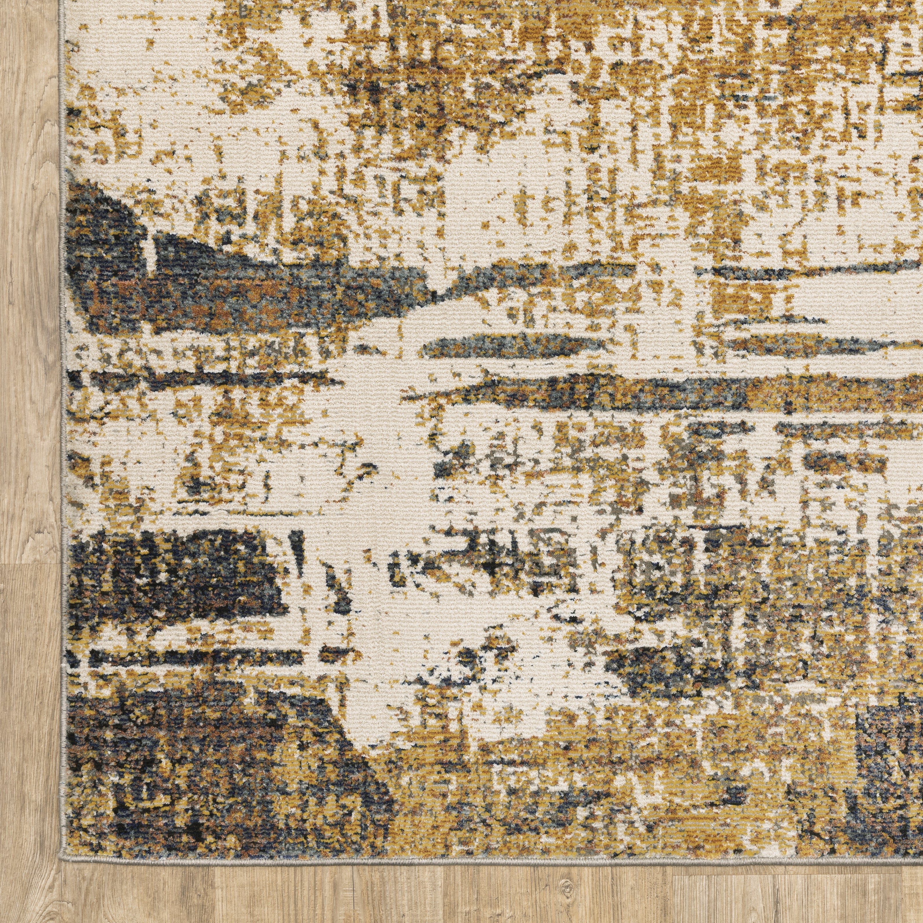 Distressed gold and cream abstract rug with vintage texture and weathered pattern design