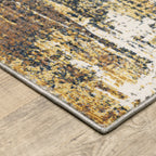 Distressed gold and cream abstract rug with vintage texture and weathered pattern design