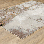 Modern distressed area rug with cream, brown, and green abstract texture pattern