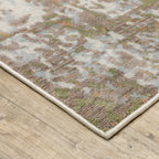 Modern distressed area rug with cream, brown, and green abstract texture pattern