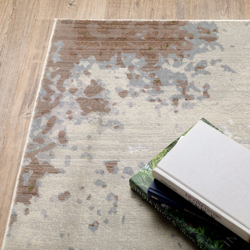 Modern distressed area rug with cream, brown, and green abstract texture pattern
