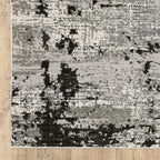 Distressed grey and black abstract textured area rug with worn vintage pattern