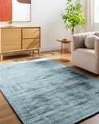 Modern distressed blue-grey rug with abstract worn texture pattern