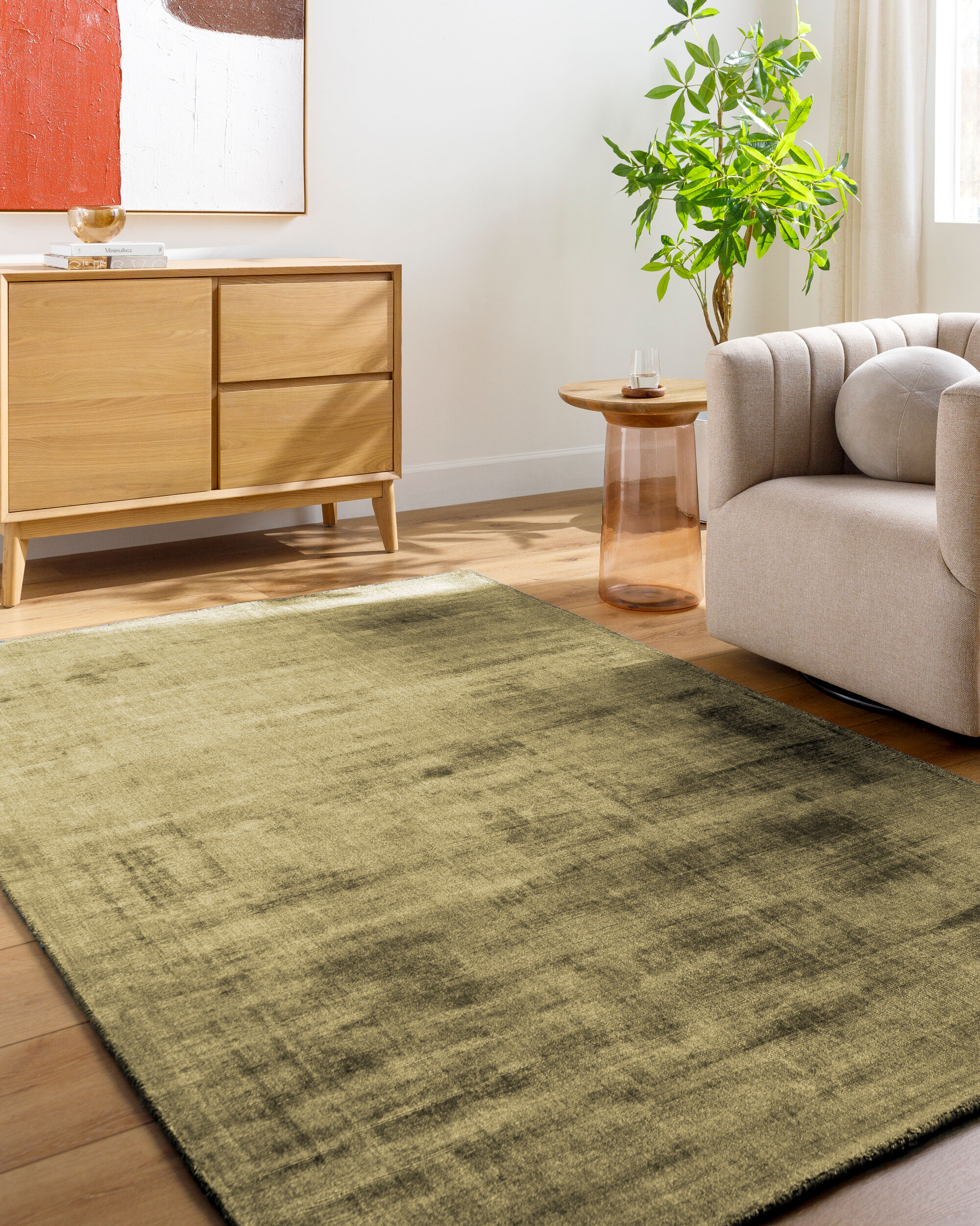 Distressed gold and charcoal textured area rug with abstract worn finish