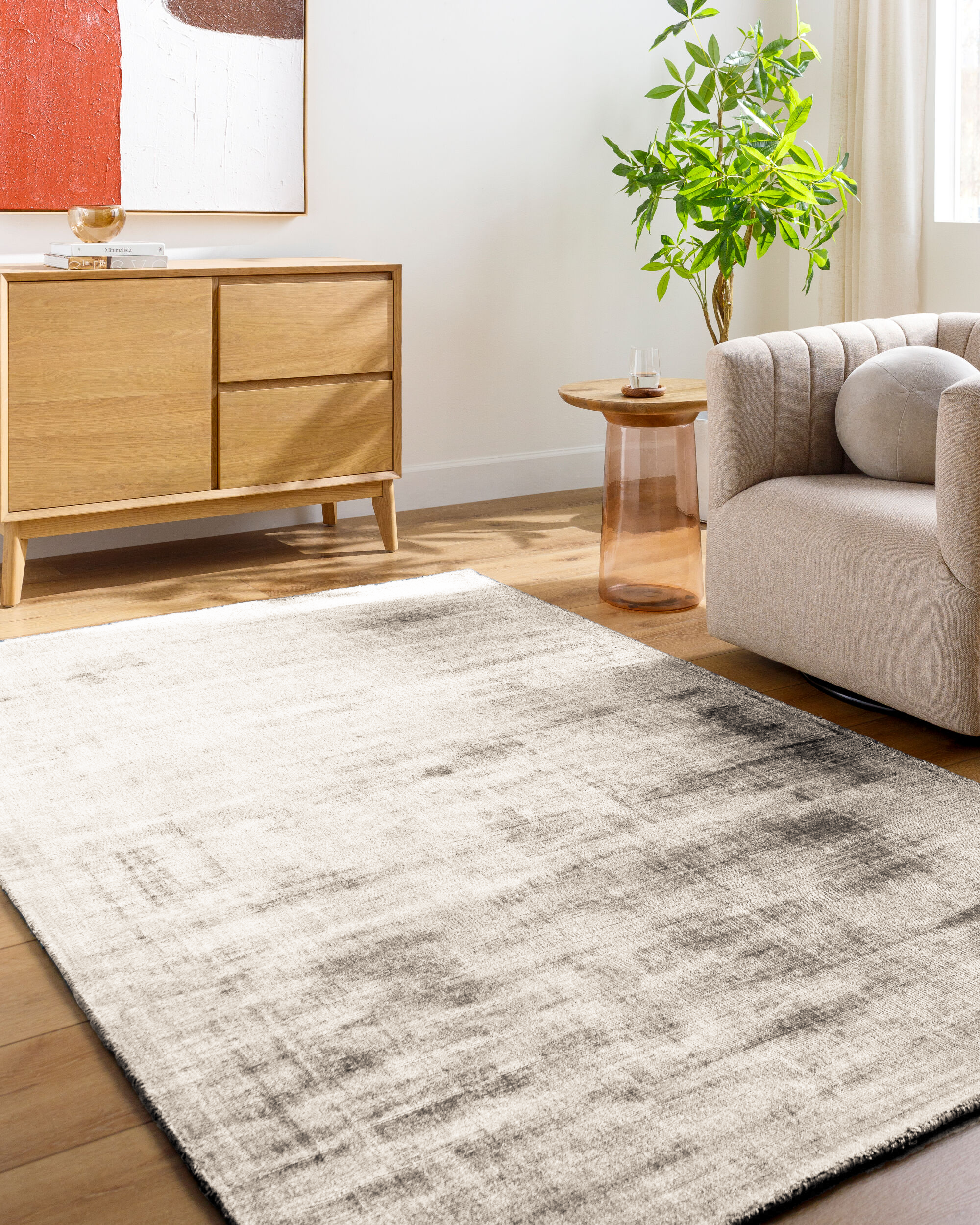 Cream and grey distressed textured rug with mottled abstract pattern