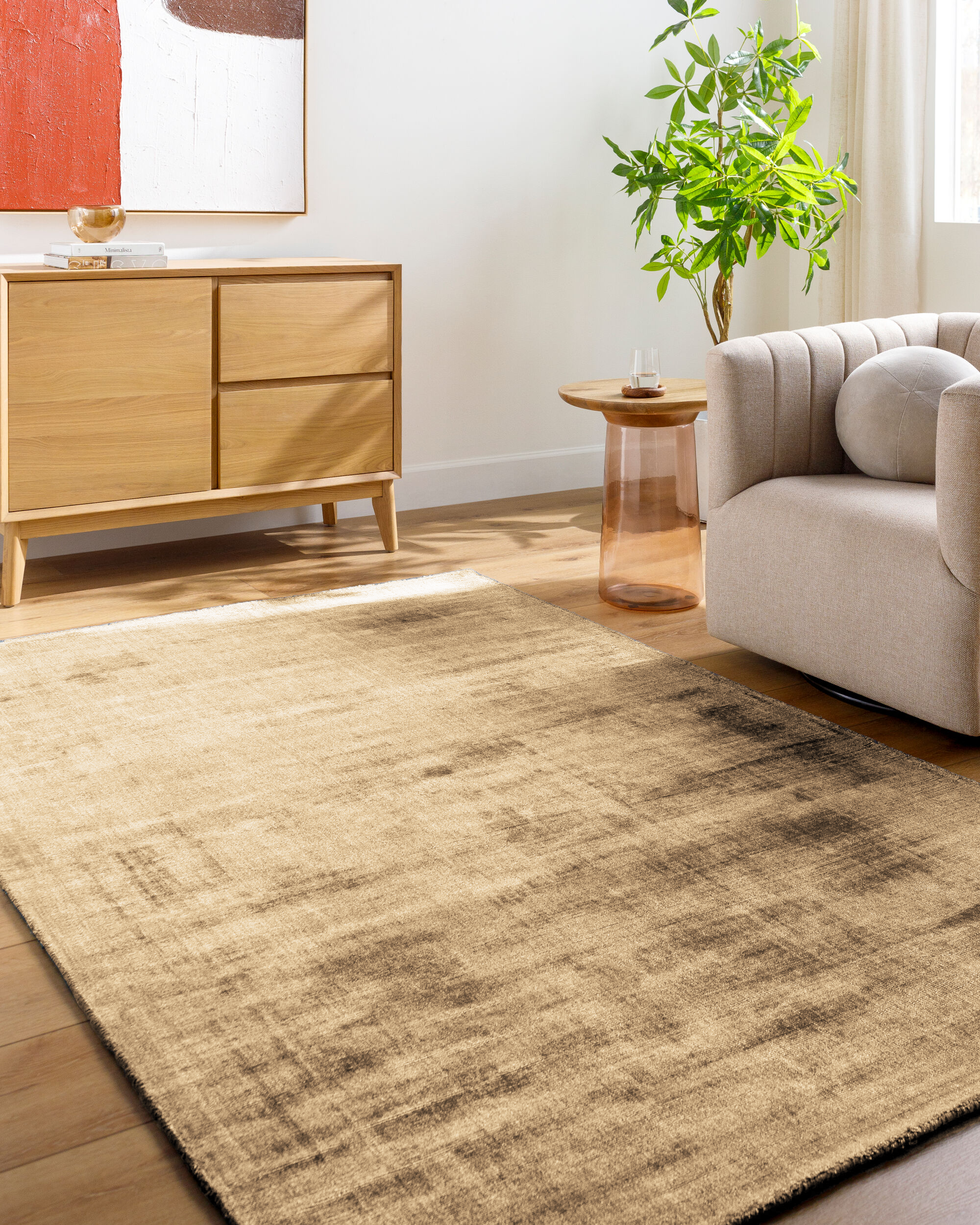 Distressed tan and brown textured area rug with worn vintage appearance