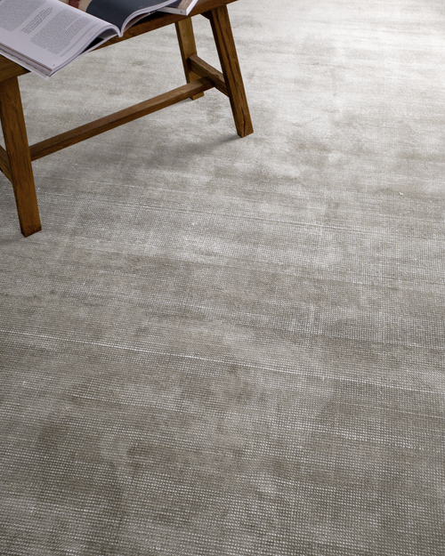 Soft grey velvet rug with subtle texture and neutral tone, rectangular shape