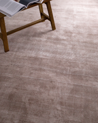 Soft taupe velvet rug with subtle texture and minimalist design