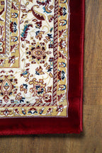 Burgundy traditional rug with ornate gold and cream floral medallion pattern