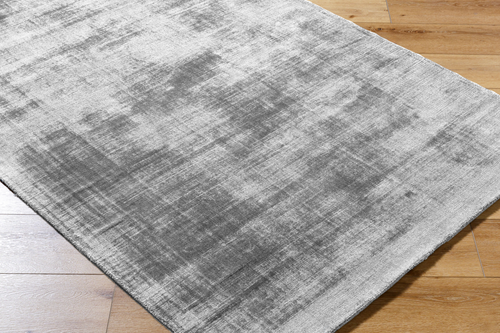 Modern grey abstract textured rug with subtle distressed pattern and soft finish