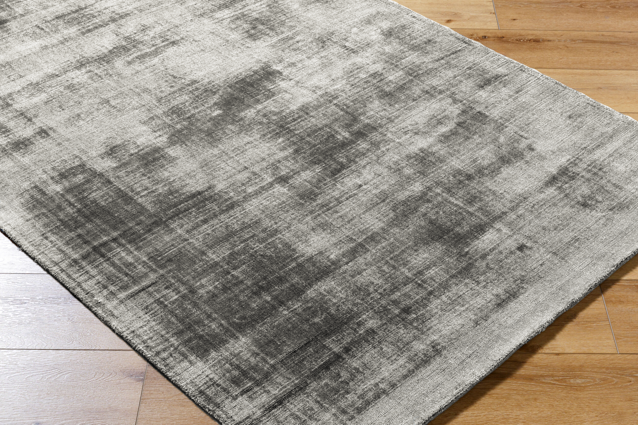 Grey distressed textured rug with abstract horizontal striped pattern