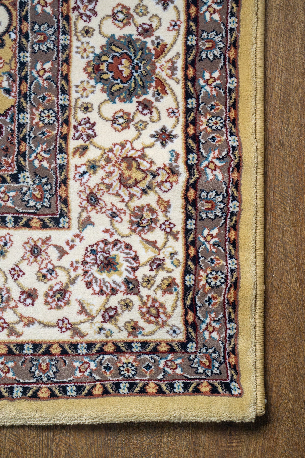 Traditional Persian rug with gold center, cream border and ornate floral medallion pattern