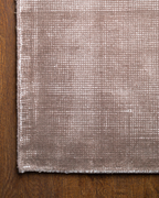 Soft taupe velvet rug with subtle texture and minimalist design