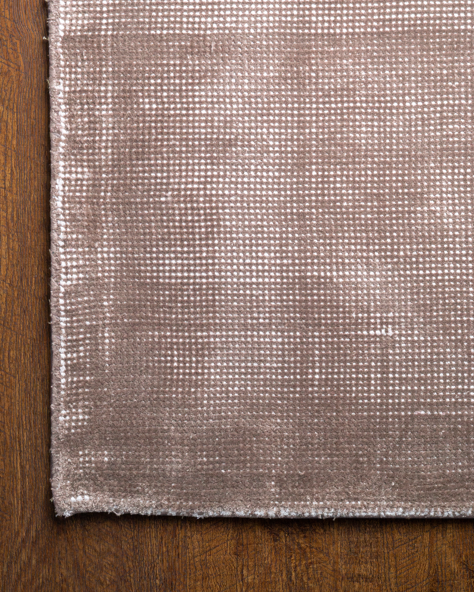 Soft taupe velvet rug with subtle texture and minimalist design