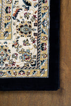 Black and gold traditional Persian style rug with ornate medallion pattern