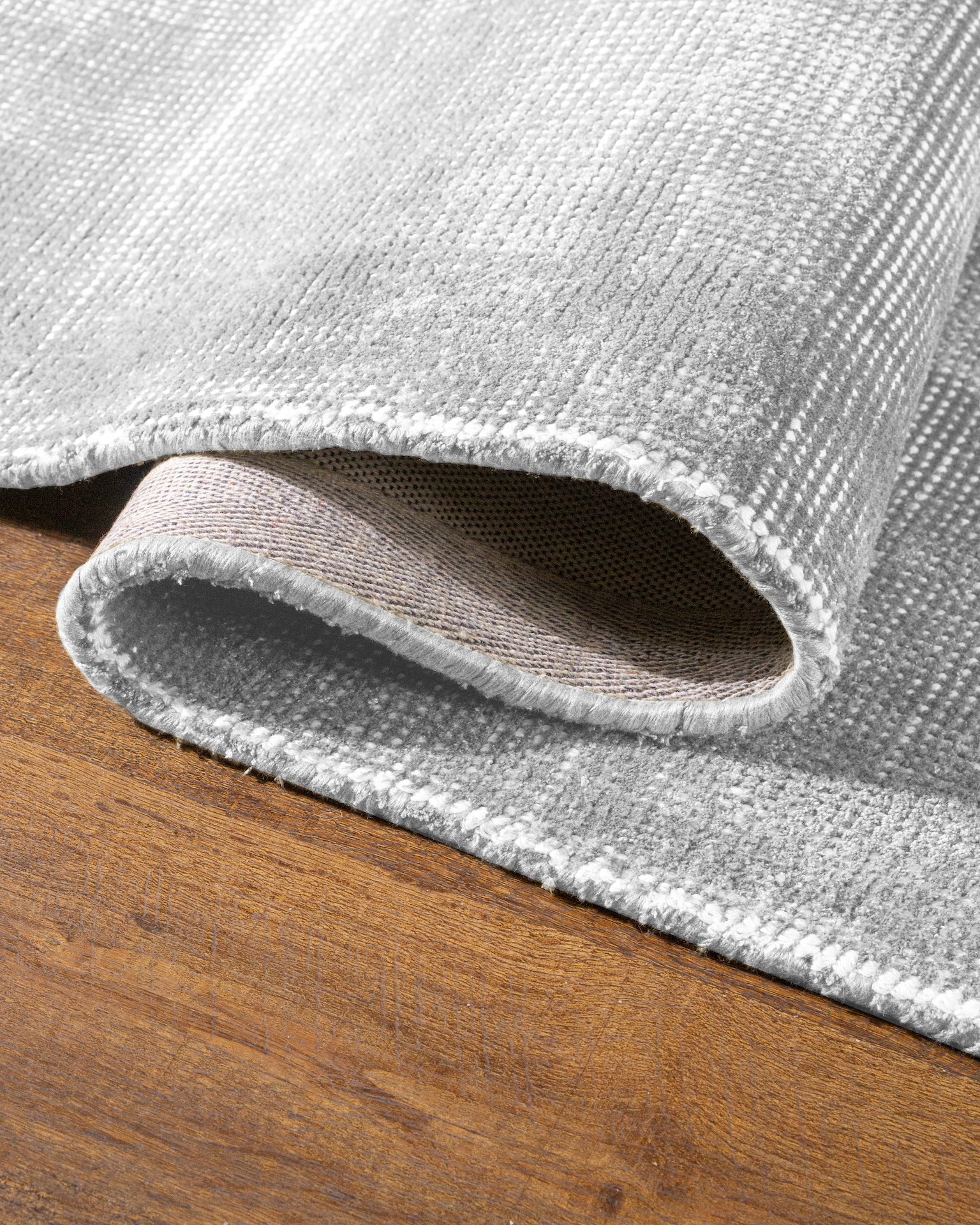 Soft gray wool area rug with subtle texture and natural weave pattern