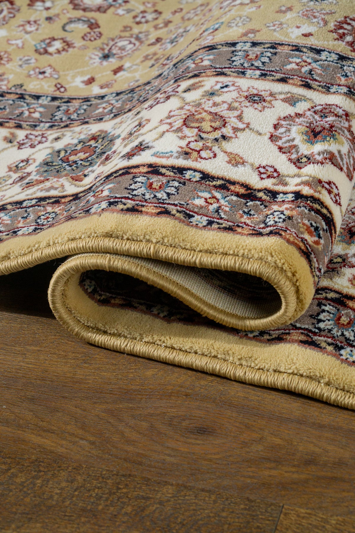 Traditional Persian rug with gold center, cream border and ornate floral medallion pattern