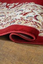 Burgundy traditional rug with ornate gold and cream floral medallion pattern