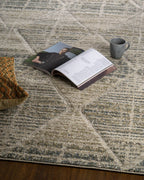 Neutral beige geometric patterned rug with textured woven appearance and diamond motifs