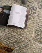 Neutral beige geometric patterned rug with textured woven appearance and diamond motifs