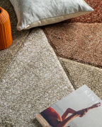 Brown and cream geometric diamond pattern area rug with textured weave