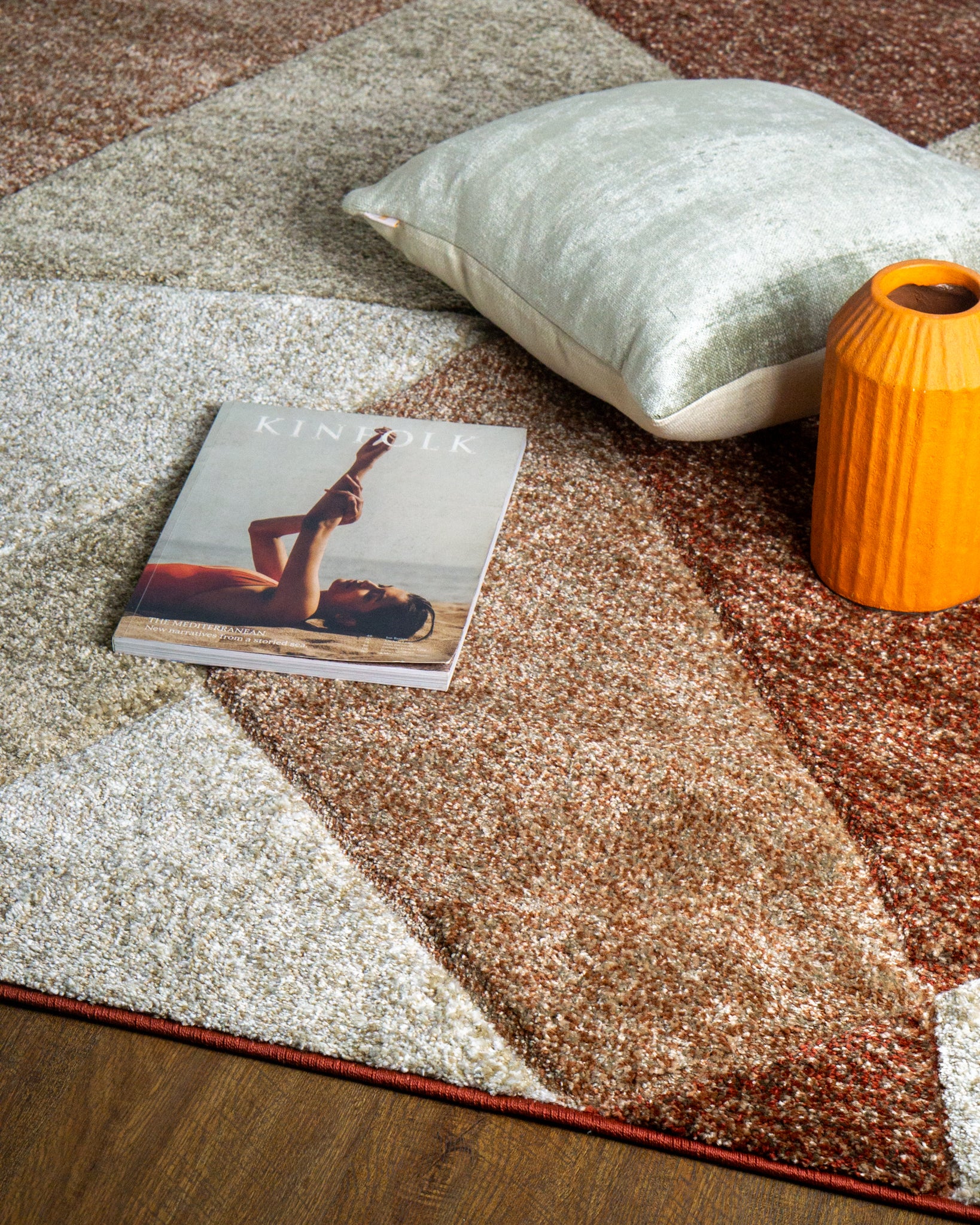 Brown and cream geometric diamond pattern area rug with textured weave