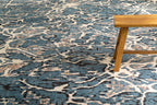 Vintage-inspired blue and cream crackle pattern area rug with distressed texture
