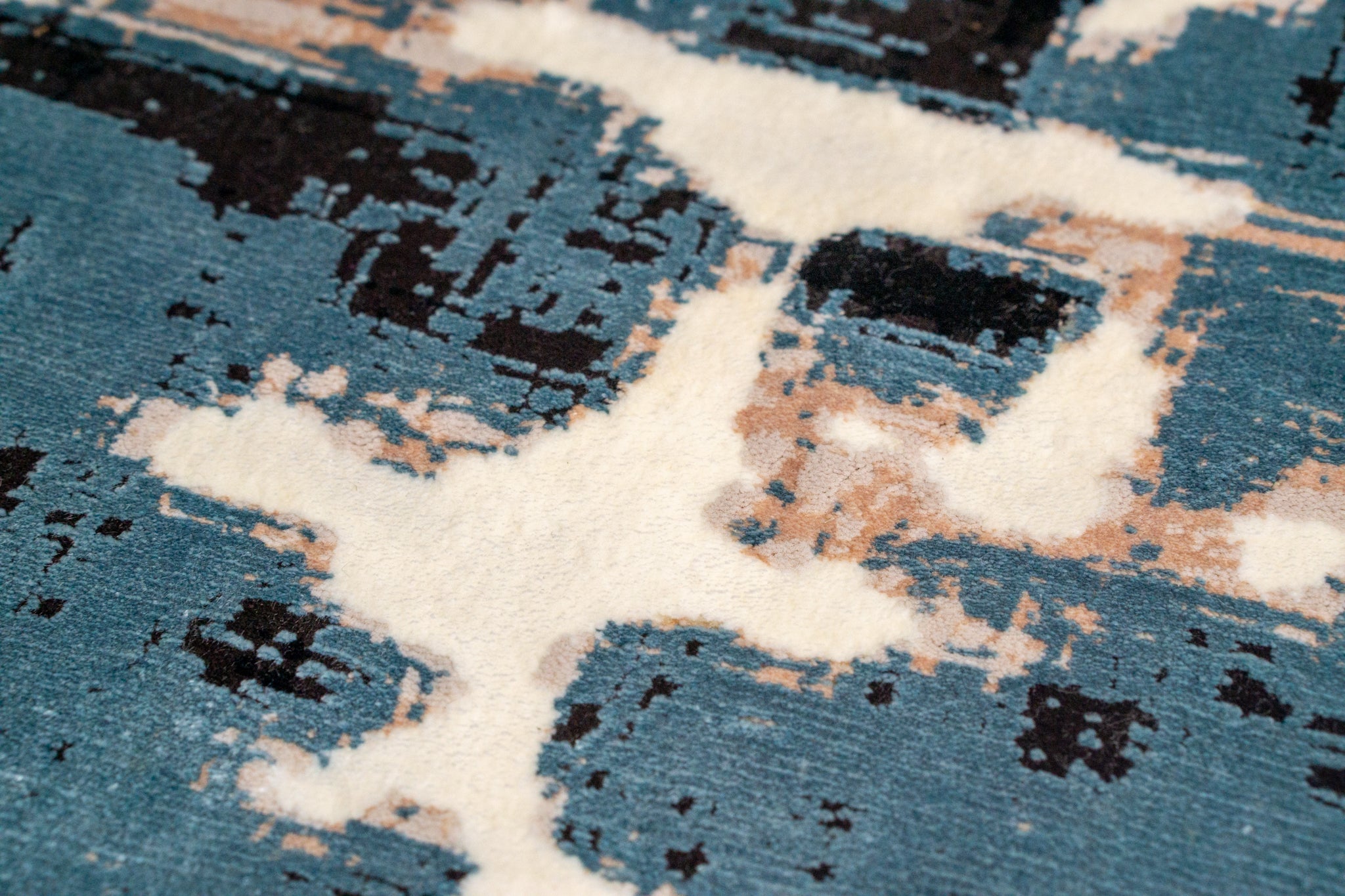 Vintage-inspired blue and cream crackle pattern area rug with distressed texture