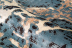 Vintage-inspired blue and cream crackle pattern area rug with distressed texture