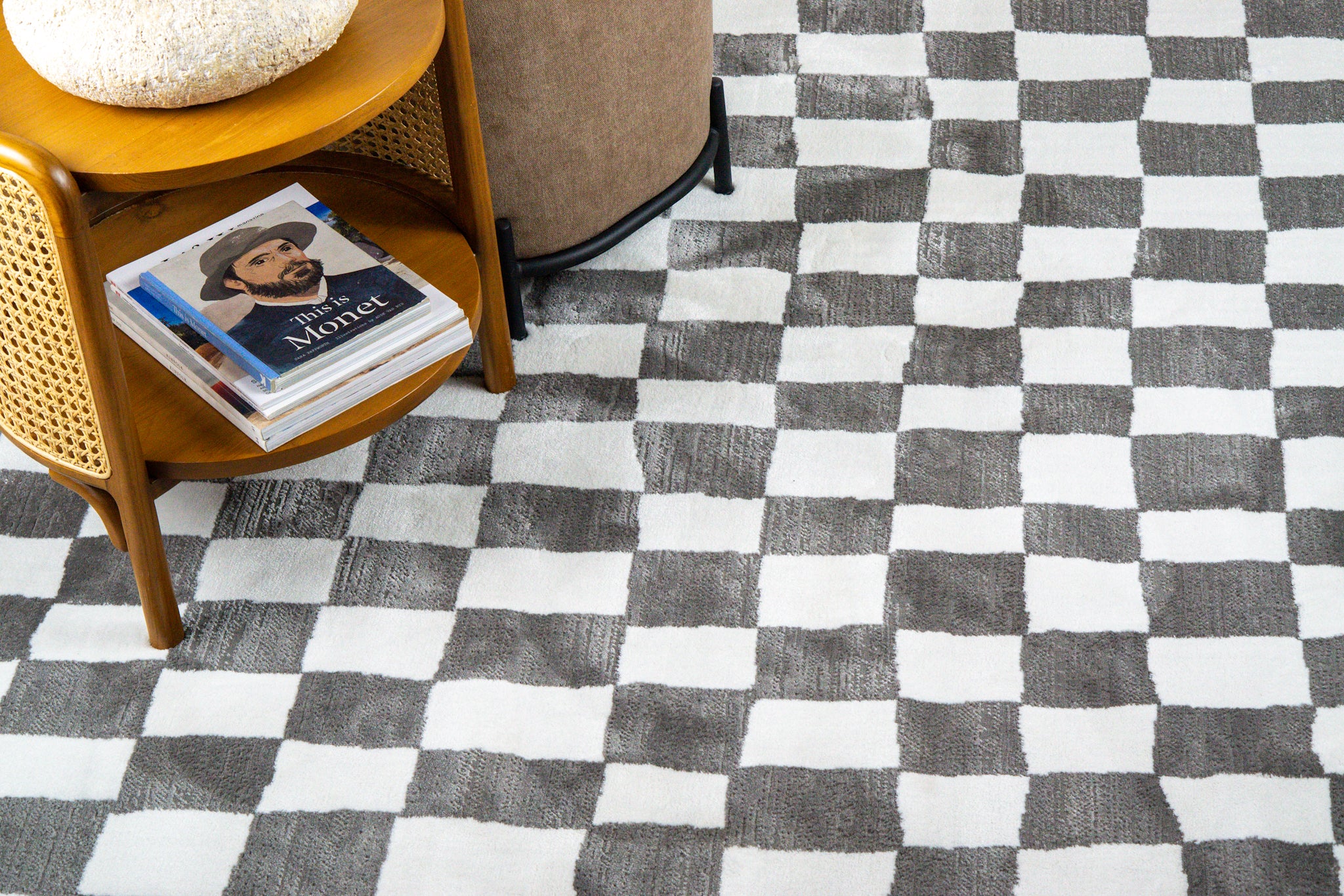 Charcoal and cream checkered wool rug with textured woven pattern
