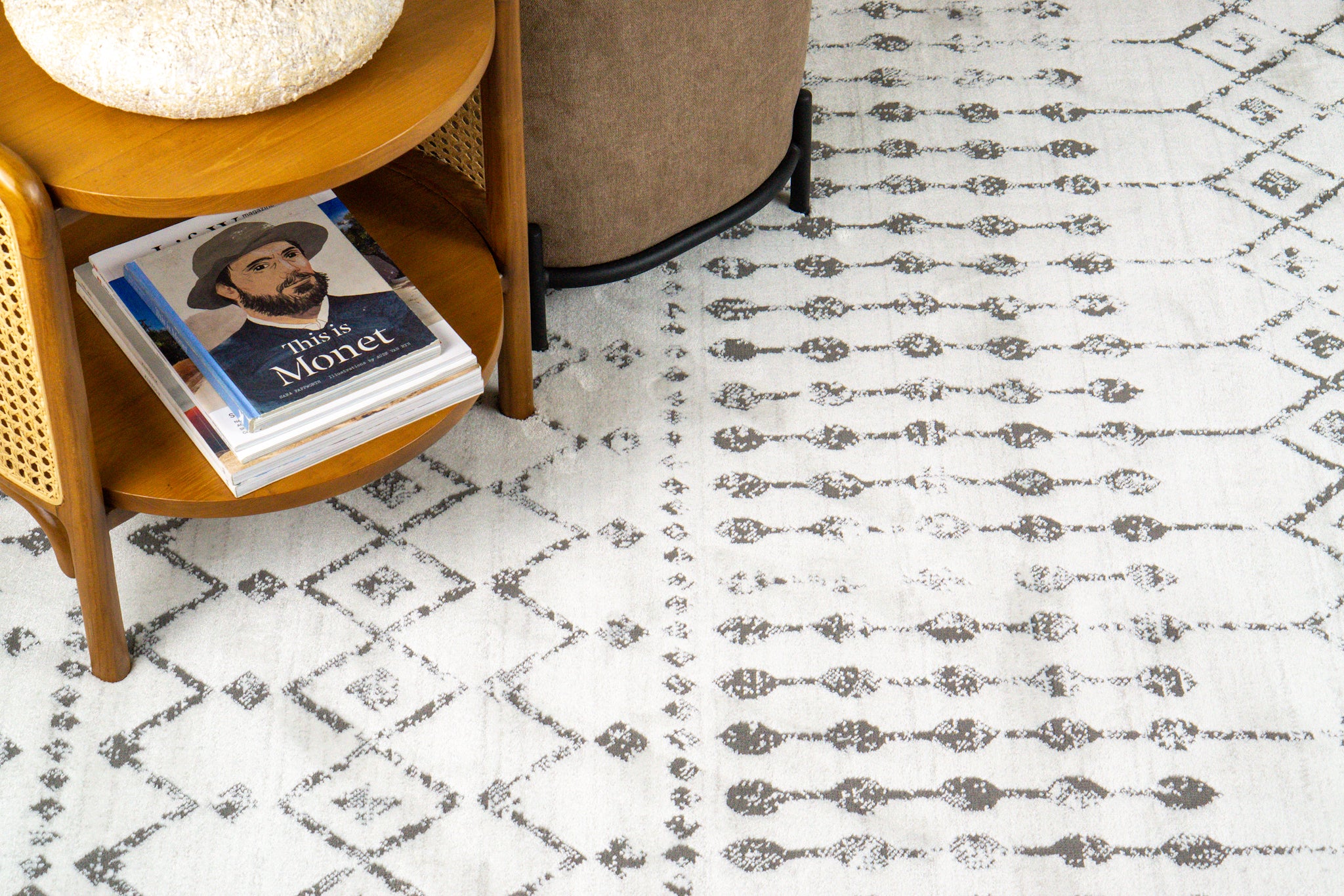 Cream and grey diamond pattern rug with tassel fringe detailing