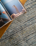 Grey and blue textured area rug with horizontal striped pattern