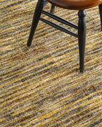 Brown textured area rug with horizontal woven pattern in natural tones