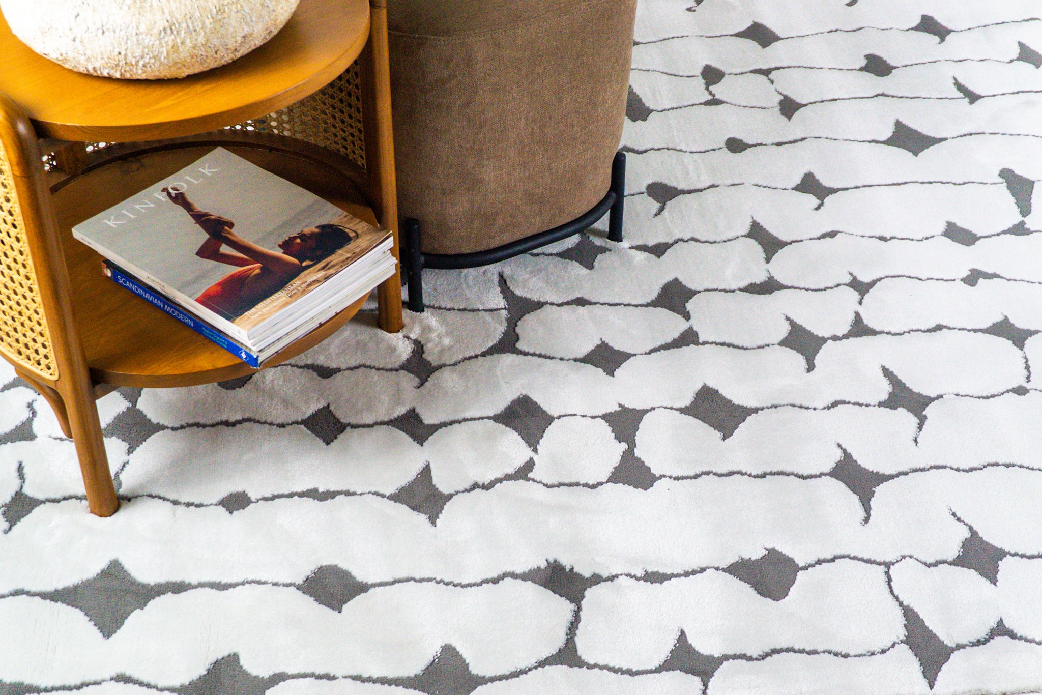 Modern geometric rug with black vertical lines and diamond shapes on white
