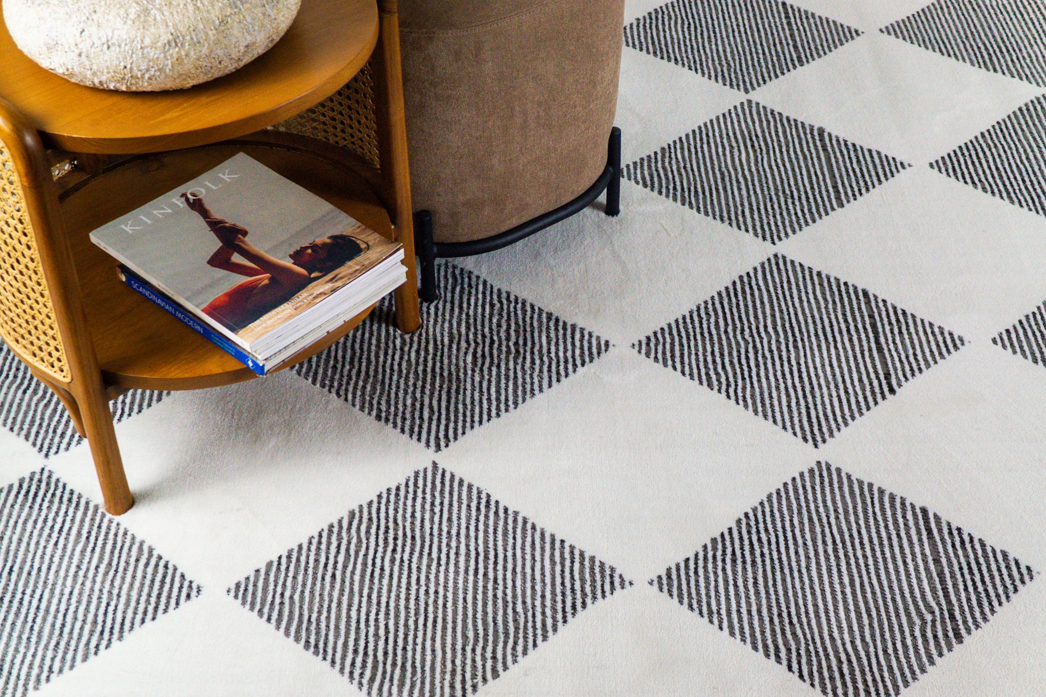 Modern geometric diamond pattern rug in black and white with textured weave
