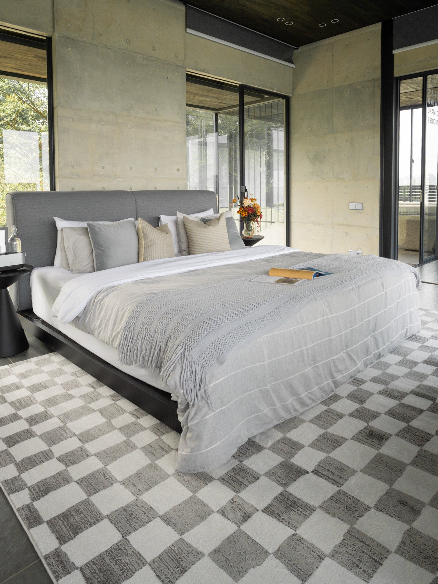 Charcoal and cream checkered wool rug with textured woven pattern